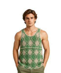 Male model wearing a green and beige diamond crochet knit tank top on white background