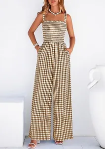 Front view of retro brown gingham jumpsuit showing the smocked bodice and wide-leg fit.