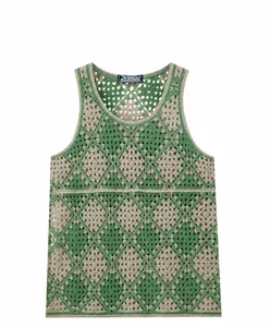 Macro view of green and beige diamond crochet sleeveless vest with hollow-out knit details.