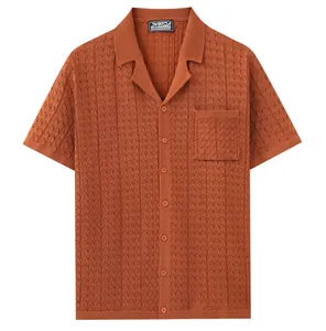 Detail of rust orange short sleeve knit polo shirt with Cuban collar and chest pocket
