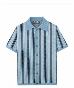 Detailed front view of a men's blue jacquard knit polo shirt with button closure.