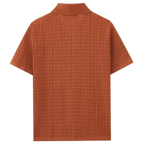 Back view of men's burnt orange short-sleeved Polo shirt with intricate chevron knit texture