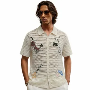 Men's white embroidered hollow-out knit polo shirt with floral patterns