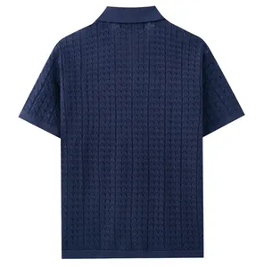 Back view of men's navy blue short sleeve knitted polo shirt with textured pattern