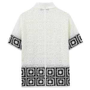 Men's white crochet knit short-sleeved polo shirt featuring black geometric patterns