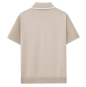 Back view detail of a premium beige men's knitted polo shirt with white collar trim