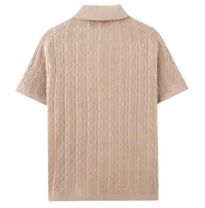 Back view detail of beige knit polo shirt featuring intricate wave texture cable pattern