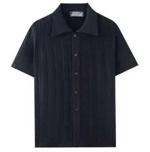 Detailed view of black wavy jacquard knit short sleeve button-down polo cardigan