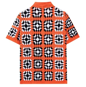 Detailed back view of a handmade crochet knit shirt with orange and black granny squares