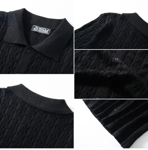 Close-up detail of black wavy jacquard polo shirt showing premium fabric texture and buttons.