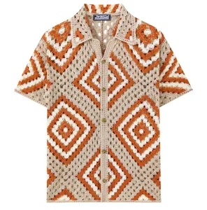 Close-up of men's hollow-out crochet short sleeve shirt with orange geometric patterns.
