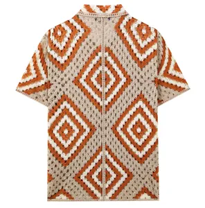 Back view of a men's crochet short-sleeve shirt with orange and white diamond patterns.