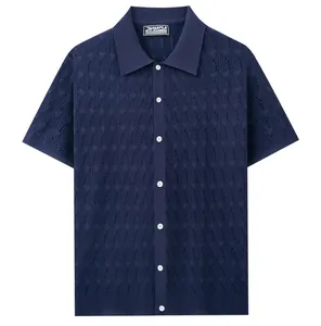 Detailed view of navy blue open-knit jacquard texture on men's short-sleeve polo shirt