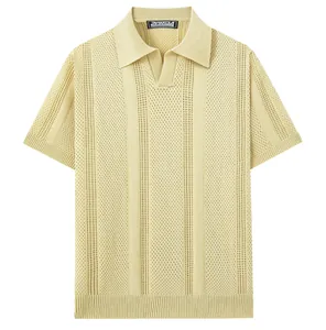 Detail of men's casual openwork knit polo shirt in pale yellow with short sleeves.