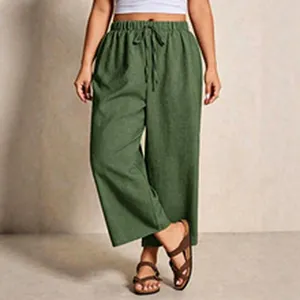 Detail of olive green wide-leg linen pants featuring a comfortable drawstring waist
