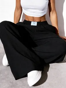 Detail view of high waist textured black wide leg trousers for women European casual style