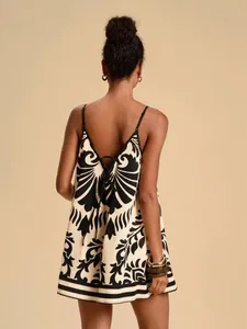 Back view of elegant printed summer camisole romper for women with tie-back detail