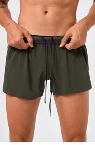 Front view detail of men's olive green quick-dry running shorts with drawstring waist