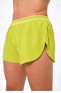 Lime green men's running shorts with double-layer design and mesh waistband detail