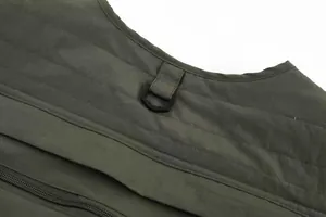 Detail view of olive green outdoor fishing vest showing D-ring and sturdy stitching