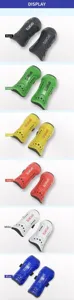 Detailed view of football shin guards in multiple vibrant color variants