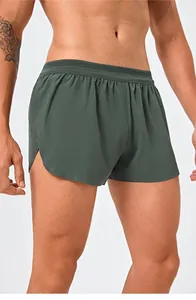 Professional close-up of men's quick-dry olive green running shorts with side split design