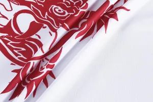 Macro view of white quick-dry mesh fabric with vibrant red dragon print detail