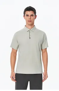 Front view of a men's light sage green athletic polo shirt with black trim detail