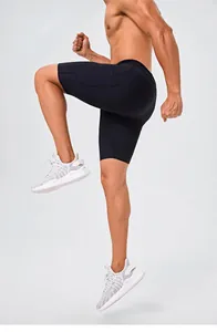 Close-up of black quick-dry sports shorts with side pocket detail on a running model