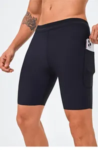 Detail view of men's athletic compression shorts featuring a side phone pocket design