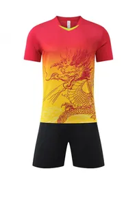 Detail view of the red and yellow gradient quick-dry sports jersey with dragon print