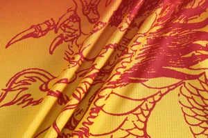 Macro view of quick-drying mesh fabric with traditional red dragon print on gradient jersey