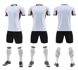 Detailed view of white breathable soccer kit with jersey, shorts, socks, and shoes.