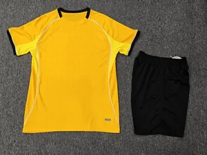Quick-dry yellow soccer jersey and black shorts sports set with breathable fabric