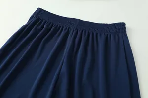 Detail shot of navy blue elastic waistband on breathable jacquard football shorts