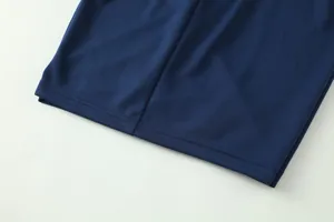 Close-up of breathable navy blue jacquard fabric for soccer training jersey.