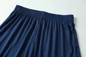 Detail view of navy blue football training shorts featuring breathable mesh and elastic.