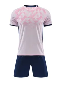 Front view of pink jacquard soccer jersey set with navy blue shorts for training.