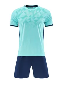 Detailed front view of cyan soccer jersey set with jacquard pattern and navy shorts