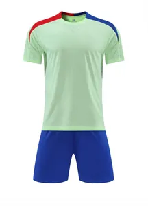 Professional breathable green football training jersey set with matching blue shorts.