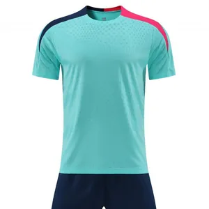 Turquoise soccer training jersey with navy and pink shoulder accents, dry-fit fabric