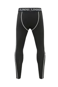 Detailed view of children's black quick-dry compression leggings with white stitching.