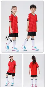 Children's red soccer jersey set with white sleeve chevrons shown in multiple views