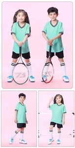 Detailed view of kids mint green soccer jersey and shorts set for sports training