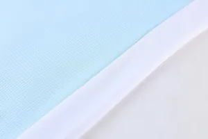 Macro close-up detail of light blue breathable mesh fabric for sports basketball jersey