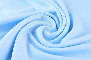 Macro detail of breathable light blue mesh fabric for quick-dry basketball jerseys