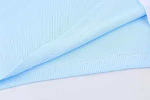Close-up of high-quality stitching and breathable mesh fabric on light blue jersey