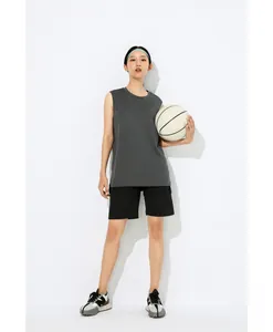 Asian female model wearing dark grey quick-dry sports tank top holding a basketball