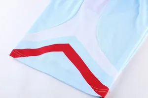 Close-up detail of quick-dry basketball jersey fabric with blue and red stripe design