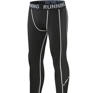 Kids quick-dry sports compression tights in black with white contrast stitching